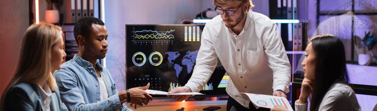 digital marketers discussing analytics on screen